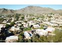 Aerial view of community nestled in the mountains at 10419 N 10Th Pl # 2, Phoenix, AZ 85020