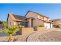 Two-story house with a landscaped walkway and garden at 17463 N 63Rd Dr, Glendale, AZ 85308