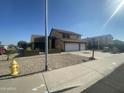 Two-story house with a two-car garage and basketball hoop at 17463 N 63Rd Dr, Glendale, AZ 85308