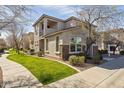 A two-story home with stone accents and manicured lawn at 17749 W Woodrow Ln, Surprise, AZ 85388