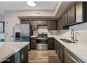 Bright kitchen featuring stainless steel appliances and a sink below the window at 18250 N Cave Creek Rd # 180, Phoenix, AZ 85032