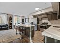 Modern kitchen featuring stainless steel appliances, a kitchen island, and sleek countertops at 18250 N Cave Creek Rd # 180, Phoenix, AZ 85032