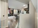 Open floor plan shows a kitchen island with bar stools, and a view into the adjacent living room at 18250 N Cave Creek Rd # 180, Phoenix, AZ 85032