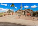 Single-story home with desert landscaping and two-car garage at 19601 N Krupps Ct, Maricopa, AZ 85138