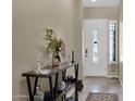 Bright entry hall with a console table and decorative accents at 2227 W Calle Del Sol --, Phoenix, AZ 85085