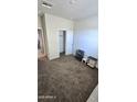 Bright bedroom featuring neutral walls and carpeted floors at 24646 N Barley Rd, Florence, AZ 85132