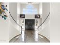 Grand entryway with a sweeping staircase and marble flooring at 2822 E Clifton Ct, Gilbert, AZ 85295