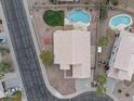 Aerial shot of the property showcasing the backyard pools, mature landscaping, neighboring homes, and the surrounding neighborhood at 2830 S Arroyo Ct, Chandler, AZ 85286