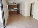 Spacious condo kitchen with tile flooring and a breakfast bar at 286 W Palomino Dr # 105, Chandler, AZ 85225