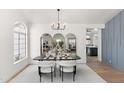 Bright dining room with modern chandelier and stylish furnishings at 29840 N 43Rd Way, Cave Creek, AZ 85331