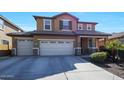 Two-story house with beige exterior, three-car garage, and landscaping at 3501 E Apricot Ln, Gilbert, AZ 85298