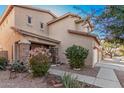 Two-story house with tan exterior, landscaping, and stone accents at 3621 W Glass Ln, Phoenix, AZ 85041