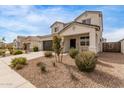 Two-story house with a brown garage door and well-manicured front yard at 36582 N Lincoln Red Rd, San Tan Valley, AZ 85143