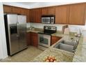 Spacious kitchen with stainless steel appliances and granite countertops at 3919 E Blue Sage Rd, Gilbert, AZ 85297