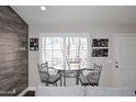 Small breakfast nook with glass table and metal chairs at 4741 S Desert Dawn Dr, Gold Canyon, AZ 85118