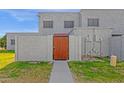 View of the front entrance of a townhome with a wooden gate at 5406 W Hearn Rd, Glendale, AZ 85306