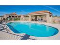 Community pool with shaded area, lounge chairs, and BBQ at 6366 N 19Th St, Phoenix, AZ 85016