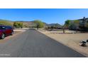 Residential street view with a red SUV and houses at 6416 W Parkside Ln, Glendale, AZ 85310