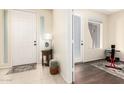 Bright entryway with tile floors, a coat closet, and access to other rooms at 6605 N 93Rd N Ave # 1082, Glendale, AZ 85305