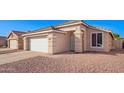 Front view of a house with a two-car garage at 10506 W Pasadena Ave, Glendale, AZ 85307