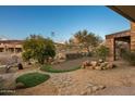 Stone pathway winds through a desert landscape at 10962 E Old Trails Rd, Scottsdale, AZ 85262