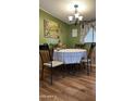 Dining room features a table with four chairs and a decorative tablecloth at 11596 W Sierra Dawn Blvd # 105, Surprise, AZ 85378