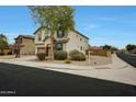 Charming two-story home boasts low maintenance desert landscaping and inviting curb appeal at 13235 W Tether Trl, Peoria, AZ 85383