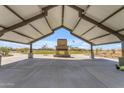 Covered pavilion with a stone fireplace perfect for gatherings at 1431 W J Waltz Way, Apache Junction, AZ 85120