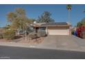 House exterior featuring a driveway and solar panels at 14840 N 21St St, Phoenix, AZ 85022