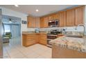 Spacious kitchen with granite countertops and stainless steel appliances at 14840 N 21St St, Phoenix, AZ 85022