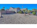 Landscaped yard with gravel and drought-tolerant plants at 16351 W Yucatan Dr, Surprise, AZ 85388