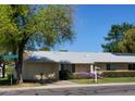 Charming single story home with well-maintained landscaping and a lovely front yard at 19002 N Signal Butte Cir, Sun City, AZ 85373