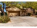 Spacious three-car garage with a large driveway and mature landscaping around the house at 19308 W Jefferson St, Buckeye, AZ 85326