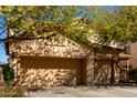 Spacious three-car garage with a large driveway and mature landscaping around the house at 19308 W Jefferson St, Buckeye, AZ 85326