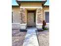 Front entry with stonework and a security door at 234 N Seymour --, Mesa, AZ 85207