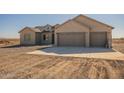 New construction home with two-car garage and desert landscaping at 2383 E Cana Ln, Casa Grande, AZ 85194