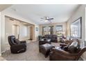 Cozy living room with plush seating, neutral walls, carpet flooring, and natural light at 3115 E Turnberry Dr, Gilbert, AZ 85298