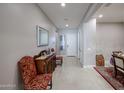 Bright entryway with tile flooring and a wooden console table at 3134 E Sunrise Pl, Chandler, AZ 85286