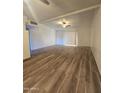 Living room with wood-look floors and a ceiling fan at 3307 W Altadena Ave, Phoenix, AZ 85029