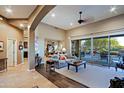 Bright and airy living room with hardwood floors, fireplace, and access to the backyard at 33448 N 69Th Pl, Scottsdale, AZ 85266