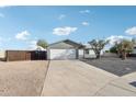 House exterior with a white exterior, two car garage and RV parking at 3410 E Everett Dr, Phoenix, AZ 85032