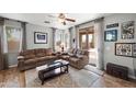 Inviting living room with wood floors, neutral colors and large sliding glass doors at 3471 E Powell Way, Gilbert, AZ 85298