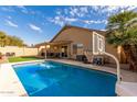 Inviting backyard oasis featuring a sparkling pool and basketball court at 3640 W Melinda Ln, Glendale, AZ 85308