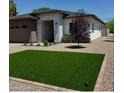 Charming single-story home featuring a modern design and well-manicured landscaping with artificial grass at 4201 N 18Th Pl, Phoenix, AZ 85016