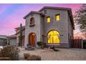 Two-story house with stucco exterior, three-car garage, and landscaped front yard at 44020 N 50Th Ln, New River, AZ 85087