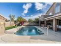 Backyard oasis with refreshing pool, patio area, and lush greenery, perfect for outdoor relaxation at 4760 W Tulsa St, Chandler, AZ 85226