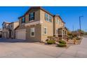 Two-story house with light brown exterior, stone accents, and a landscaped front yard at 5172 E Desert Forest Trl, Cave Creek, AZ 85331