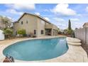 Inviting kidney-shaped pool with a large patio area at 629 E Palo Verde St, Casa Grande, AZ 85122