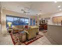 Open floor plan living room with adjacent kitchen at 7073 E Brilliant Sky Dr, Scottsdale, AZ 85266