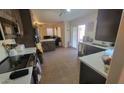 Modern kitchen with dark brown cabinets and white countertops at 736 E Ivanhoe St, Chandler, AZ 85225